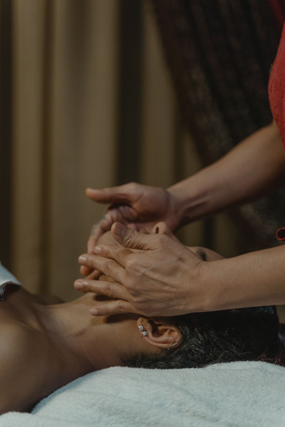 A facial treatment being performed in soft daylight