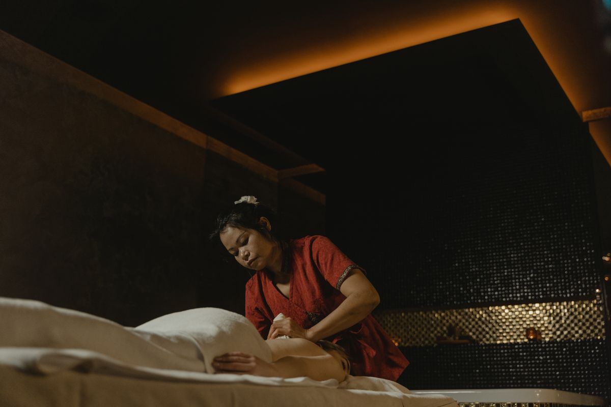 Therapist performing a soothing body massage