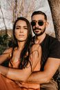 Man in Black Crew Neck T-shirt Beside Woman in Black Tank Top
