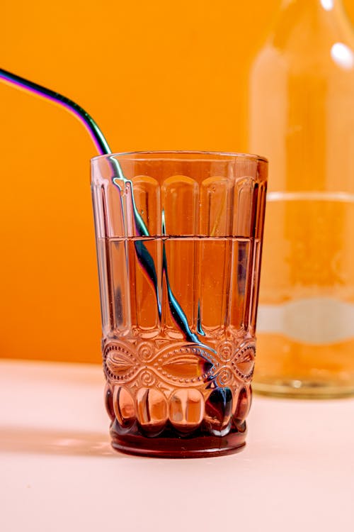 
A Close-Up Shot of a Glass of Water with a Straw