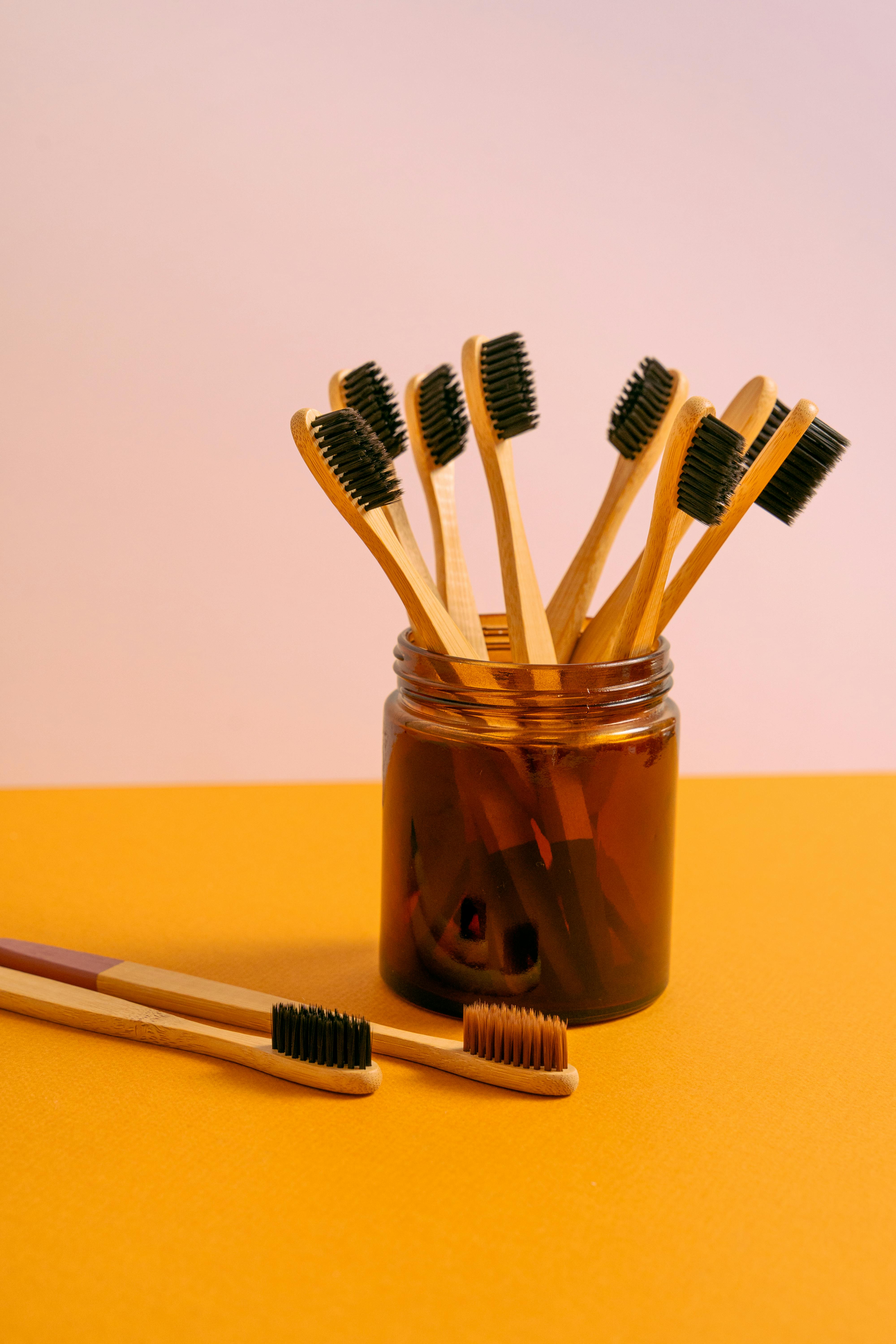 CloseUp Shot of Wooden Toothbrushes in a Jar · Free Stock Photo