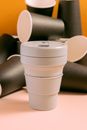 White Plastic Cup on Brown Wooden Table