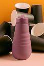 Pink Plastic Tumbler on Persons Lap