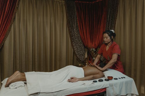 A Woman Massaging a Person