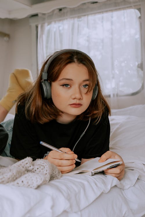 Close-Up Shot of a Woman Wearing Headphones