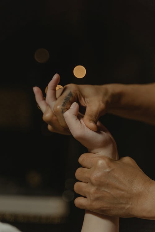 Person Massaging the Palm of a Hand