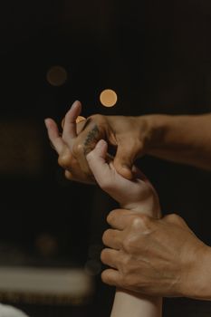 A soothing hand massage captured during a calming spa treatment session.