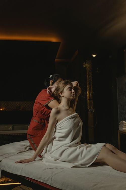 A Massage Therapist Massaging the Woman