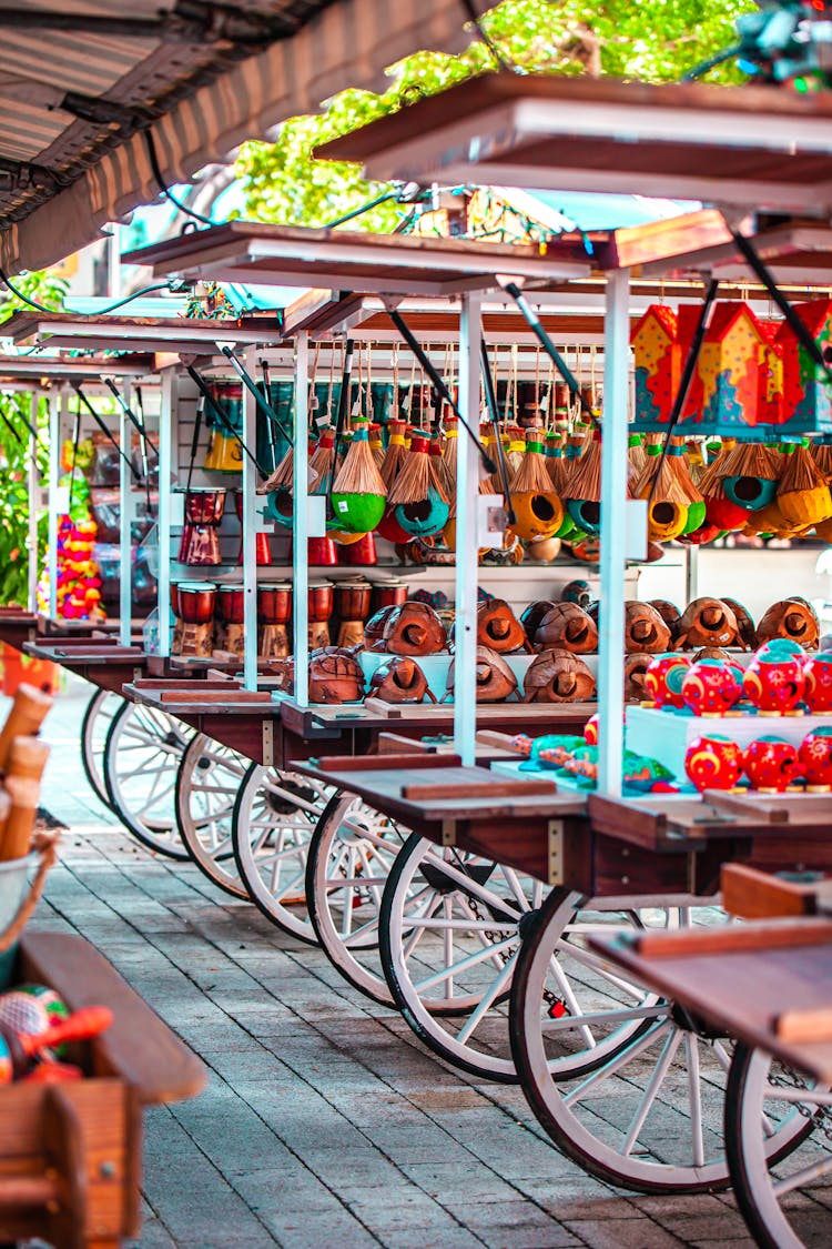 Variety Of Souvenirs On Display On Carts 