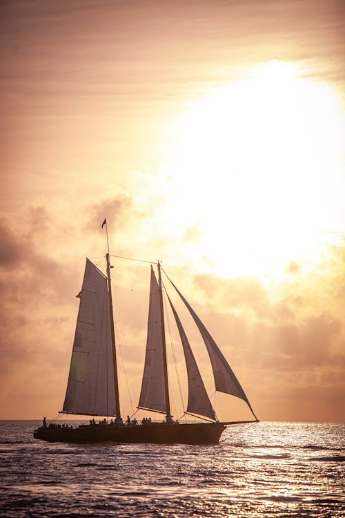 Sailboat at Sea During Sunset