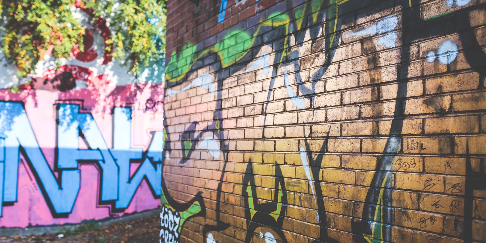 Colorful street-art mural painted on a brick wall
