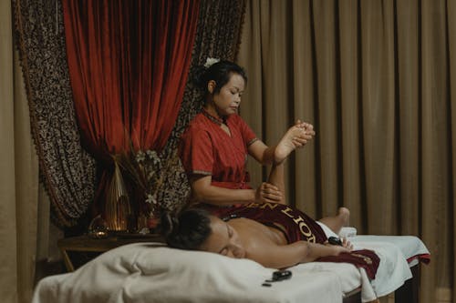 A Masseuse Doing a Massage