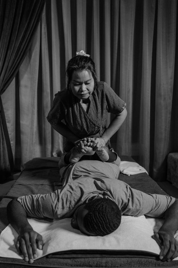 A Woman Doing A Massage To A Man