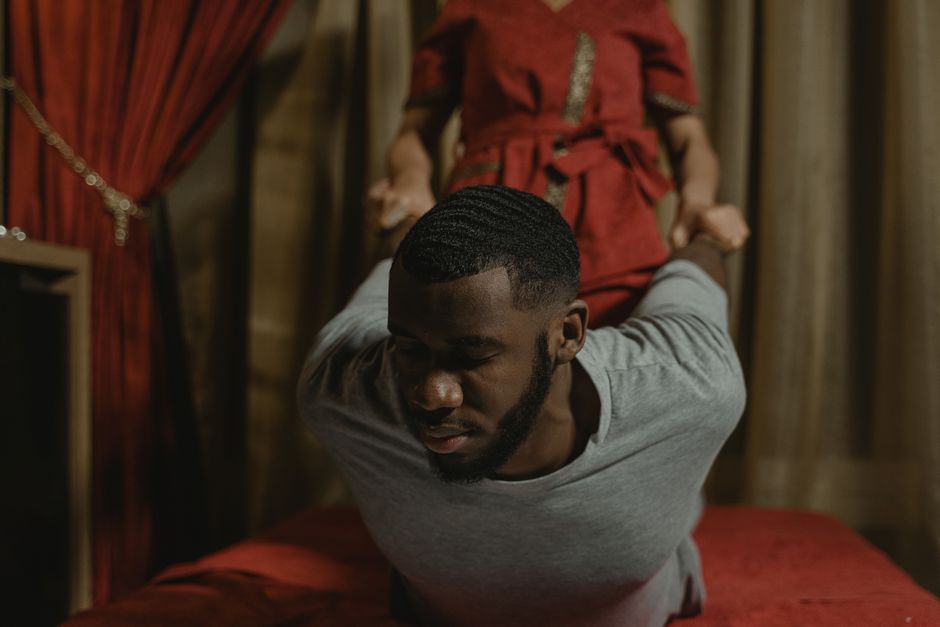 A man enjoying a therapeutic massage at a luxurious spa, enhancing relaxation and recovery.