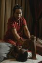 Man in Red Polo Shirt Sitting on Bed