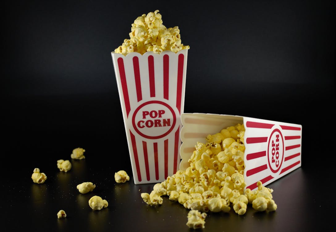 Free Popcorn in White and Red Striped Paper Cups Stock Photo