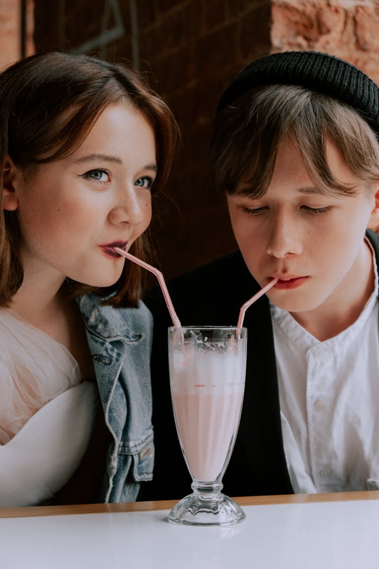 
A Couple Drinking A Milkshake