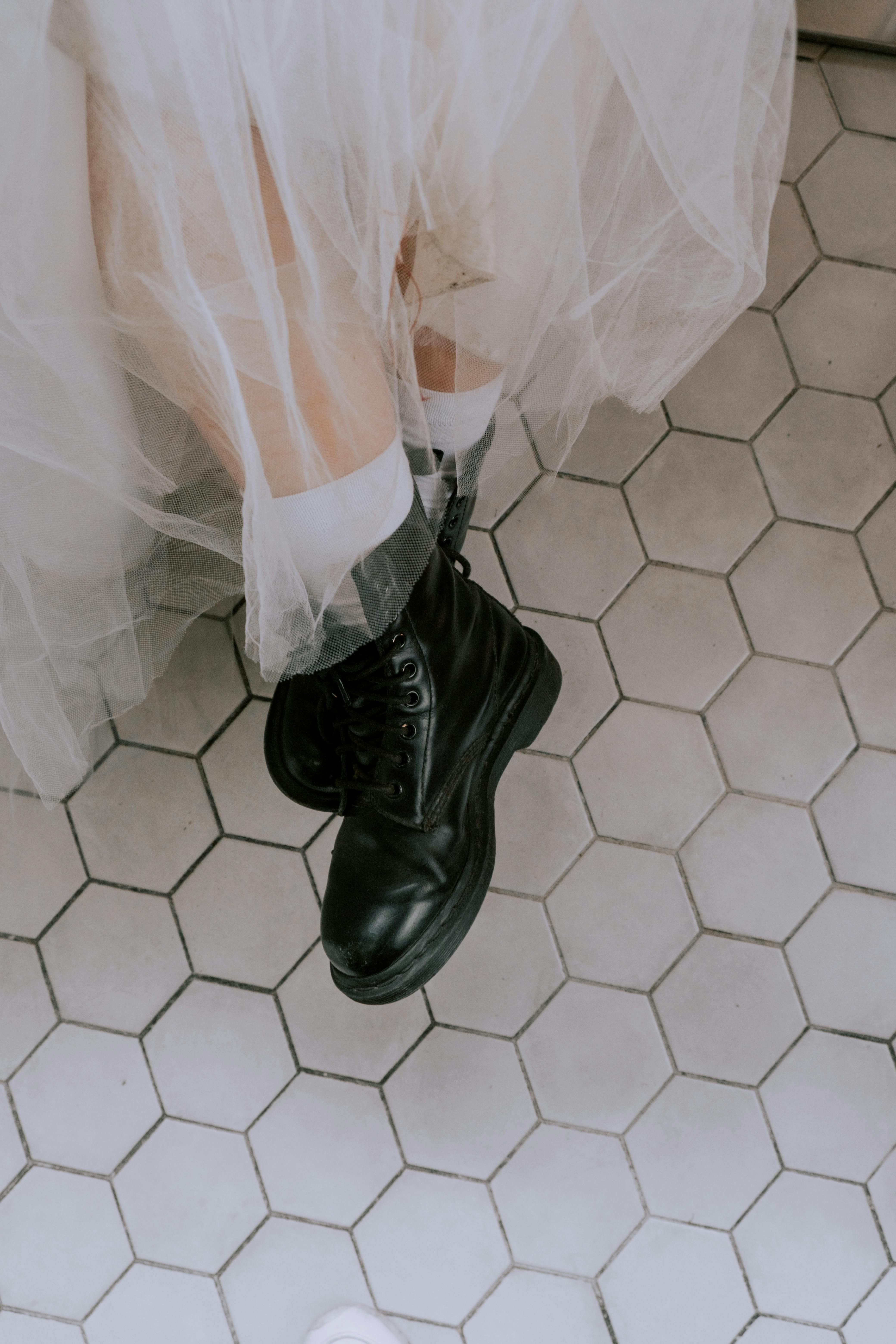 A Bride Wearing Black Leather Boots  Free Stock Photo