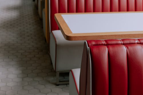 White Wooden Table and Leather Chairs in a Restaurant