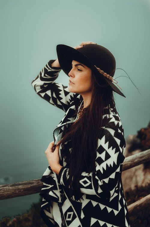 Free Woman in Black and White Outfit Wearing Black Hat  Stock Photo
