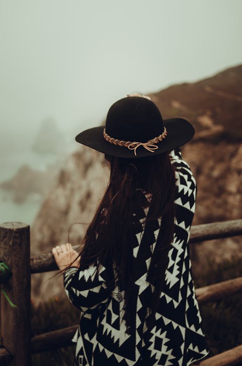 Back View of a Woman Wearing a Hat