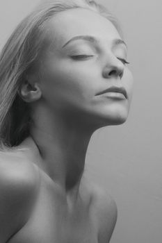 Black and white portrait with eyes closed, Kyiv model in minimalist style.