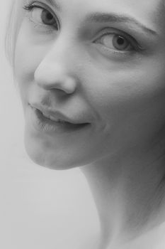 Elegantly composed grayscale portrait capturing a woman's serene expression.