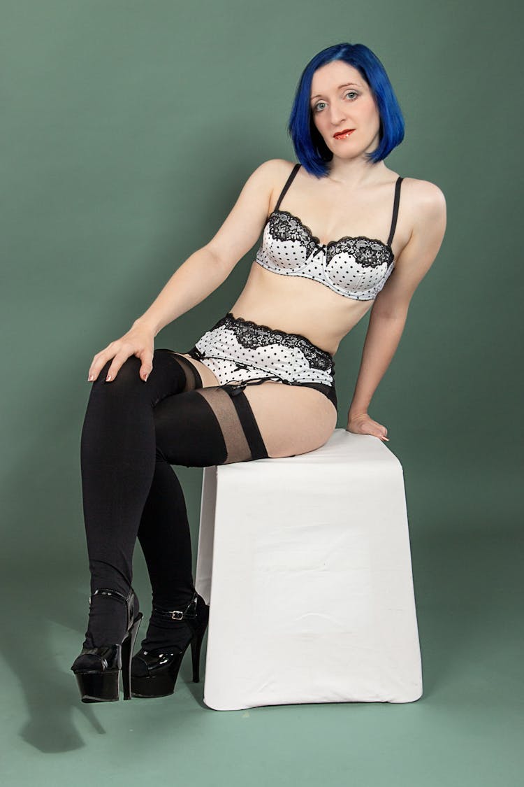 A Woman With Blue Hair Wearing Underwear