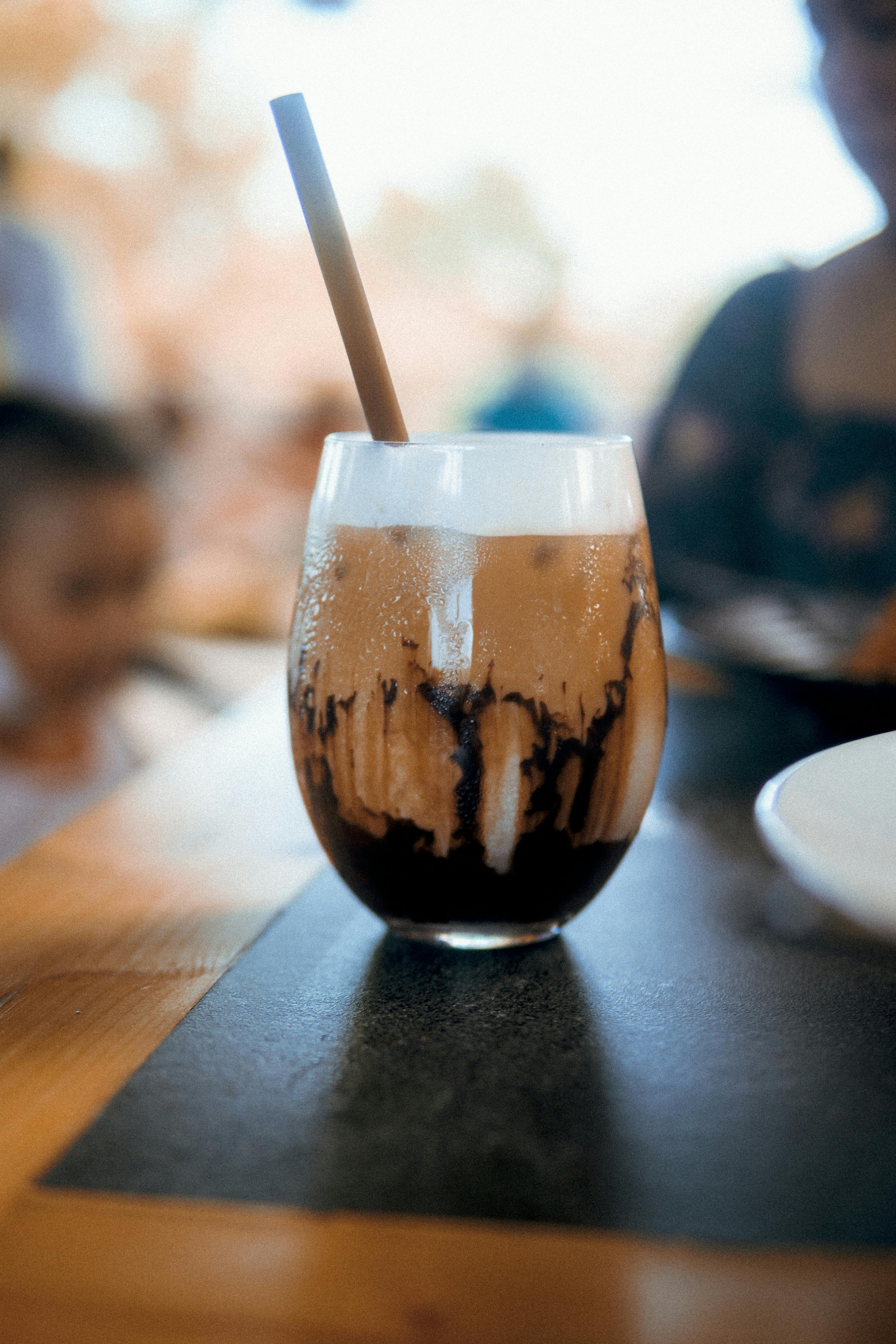 A Glass Jar Of Iced Coffee On The Table Stock Photo, Picture and Royalty  Free Image. Image 93747087.