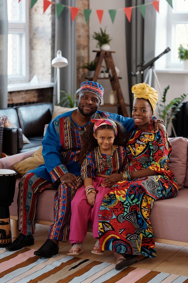 Photo Of Family Sitting On Couch