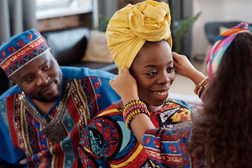 Free Photo Of Child Touches Woman's Head Wrap Stock Photo