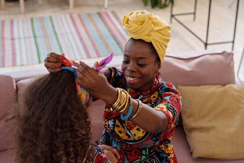 Free Photo Of Mother Fixes Her Daughter's Headband Stock Photo