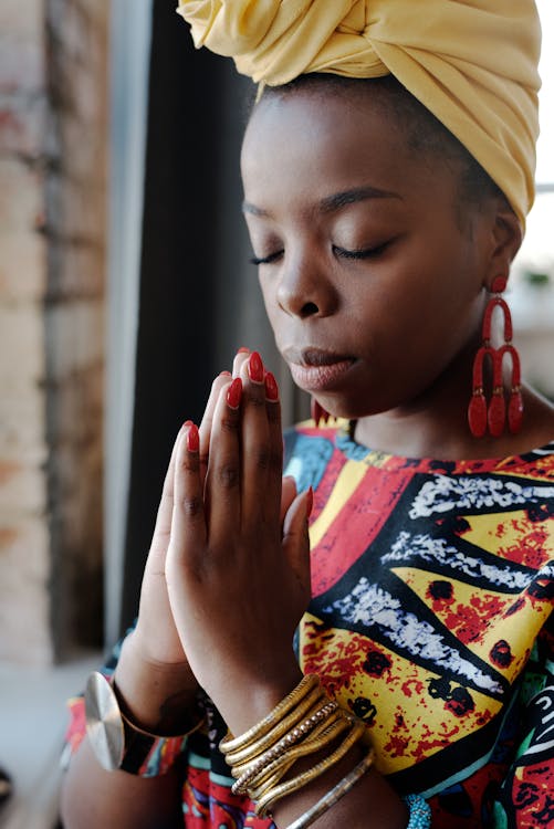 Free Close-Up Photo Of Woman Praying Stock Photo