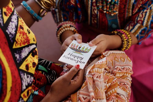 Free Photo Of People Holding A Greeting Card Stock Photo