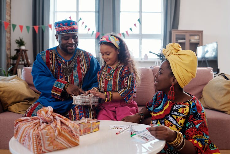 Photo Of Family Wrapping Gifts