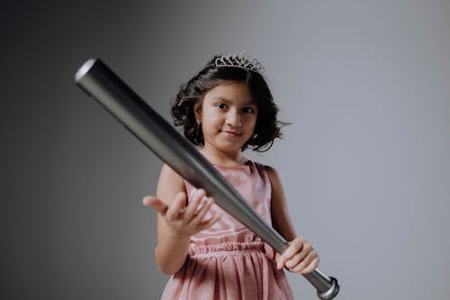 Young Girl Holding a Baseball Bat