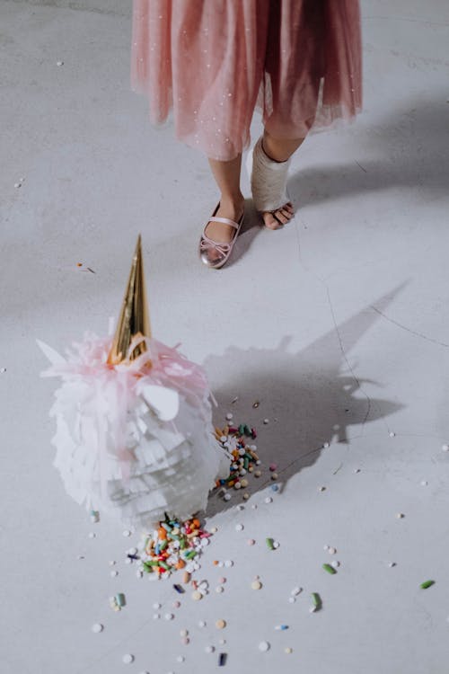 Woman in Pink Dress With Gold Open Toe Sandals