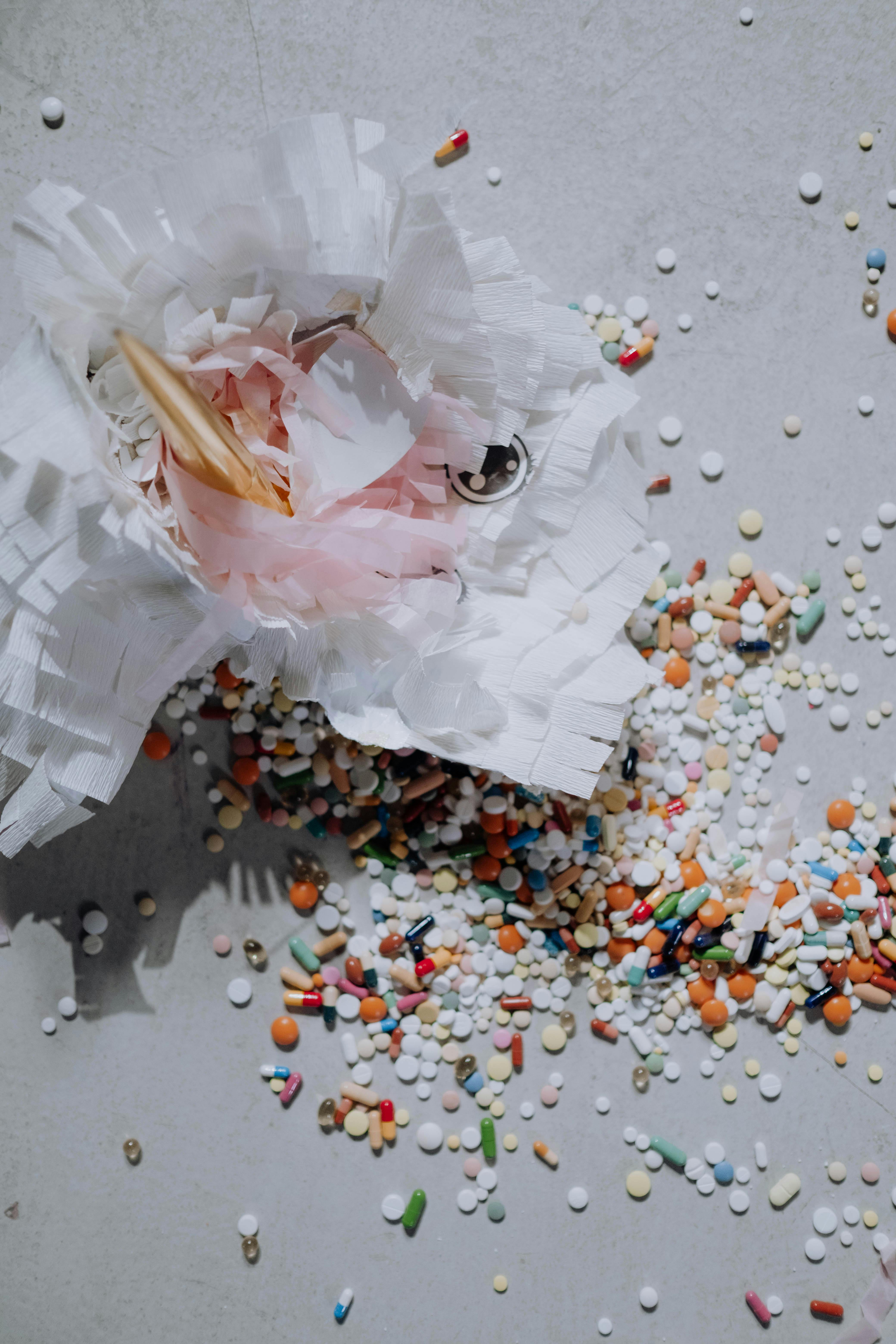 paper decoration and variety of pills scattered on the surface