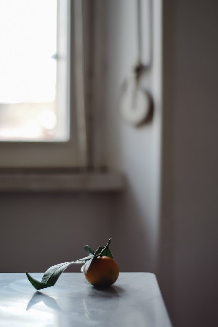 A Clementine On The Table