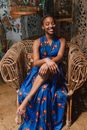 Photo Of Woman Sitting On Wooden Chair