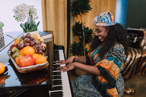 Free Photo Of Woman Playing Piano Stock Photo