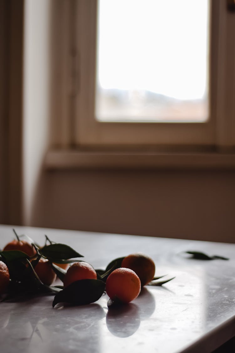 Tangerines Lying On A Kitchen Counter 