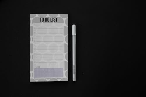 Free A Pen Beside a To do List Stock Photo