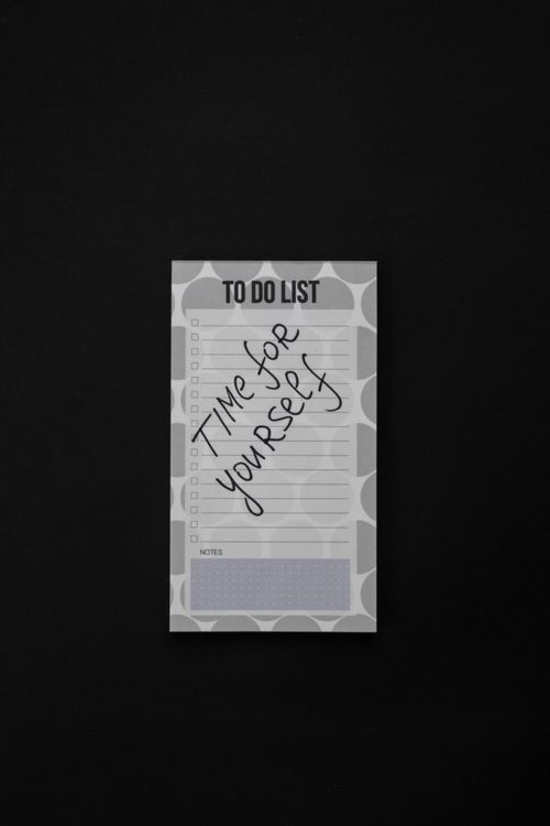Free Close-up of a minimalist notepad with a 'Time for yourself' message, ideal for wellness themes. Stock Photo