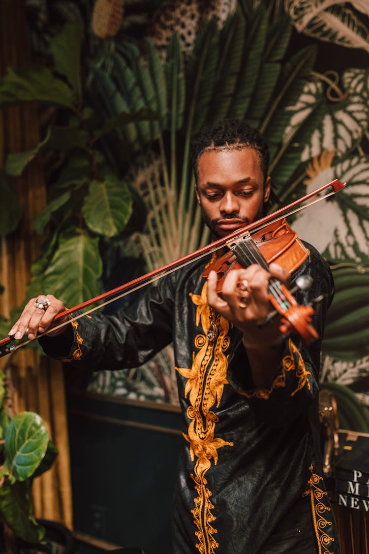 Photo Of Man Playing Violin