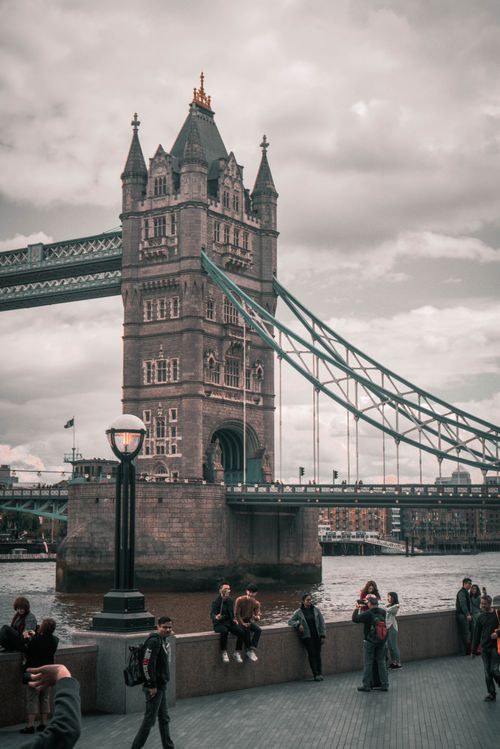 Free View of Tower Bridge with people on the promenade in London, UK. Stock Photo