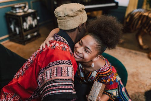 Free Woman Hugging The Man For A Gift Given Stock Photo