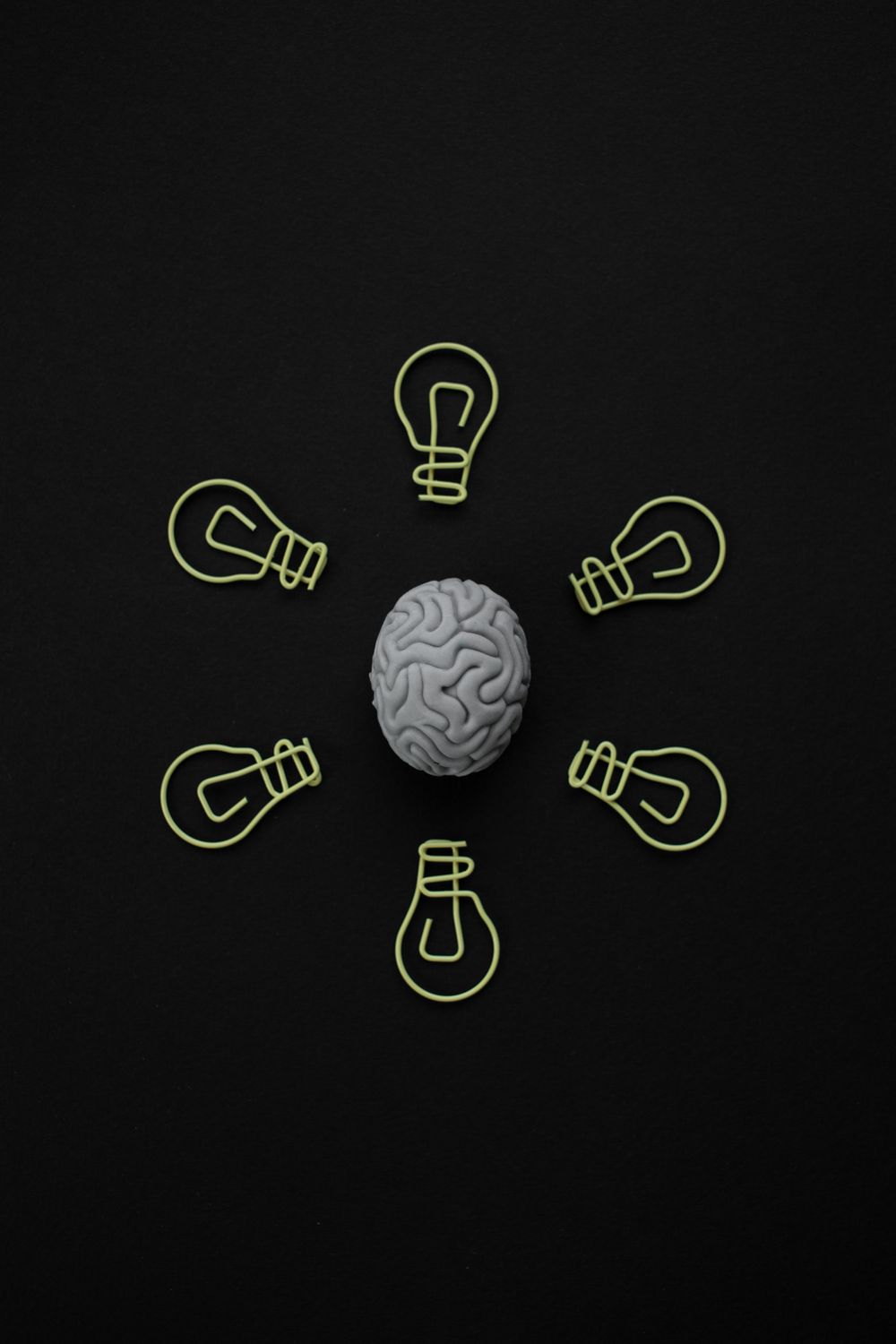 Paperclip Shape Bulb Bulb Shape Paper Clips around an Eraser · Free Stock Photo