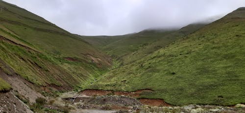 Green Mountain Under White Sky