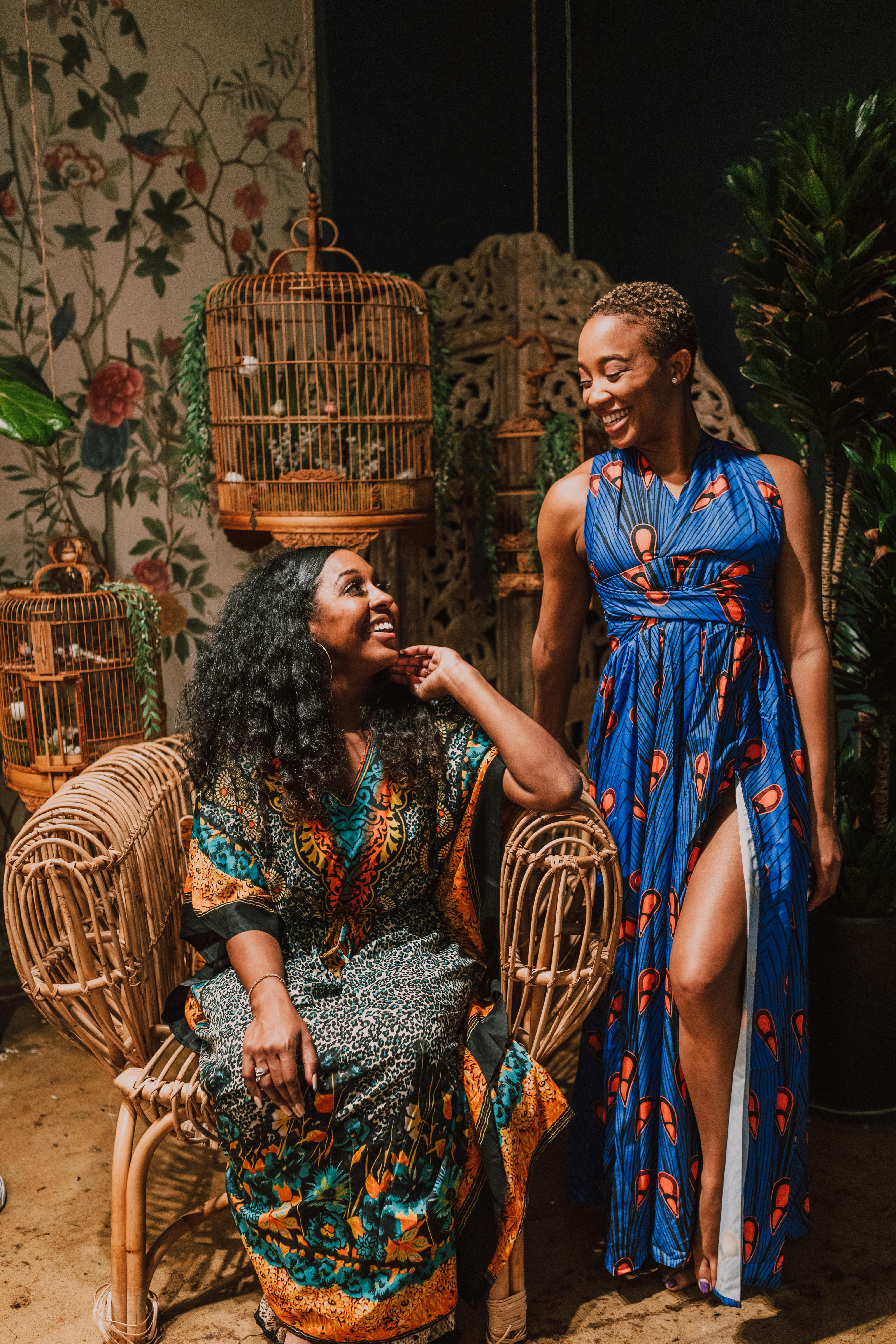 two smiling women in kaftan dress